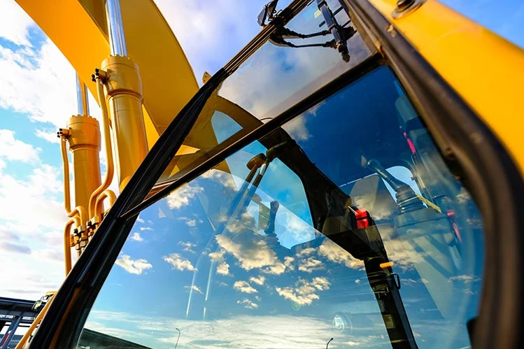 Safety glass for mining and farming machinery
